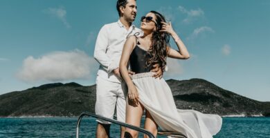 woman in white dress standing on boat during daytime